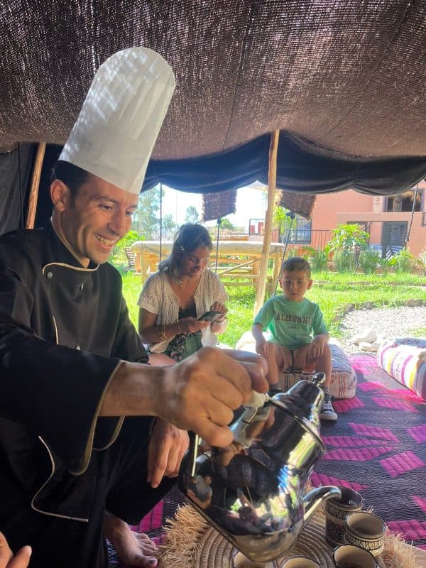 The lodge chef with guests in the garden