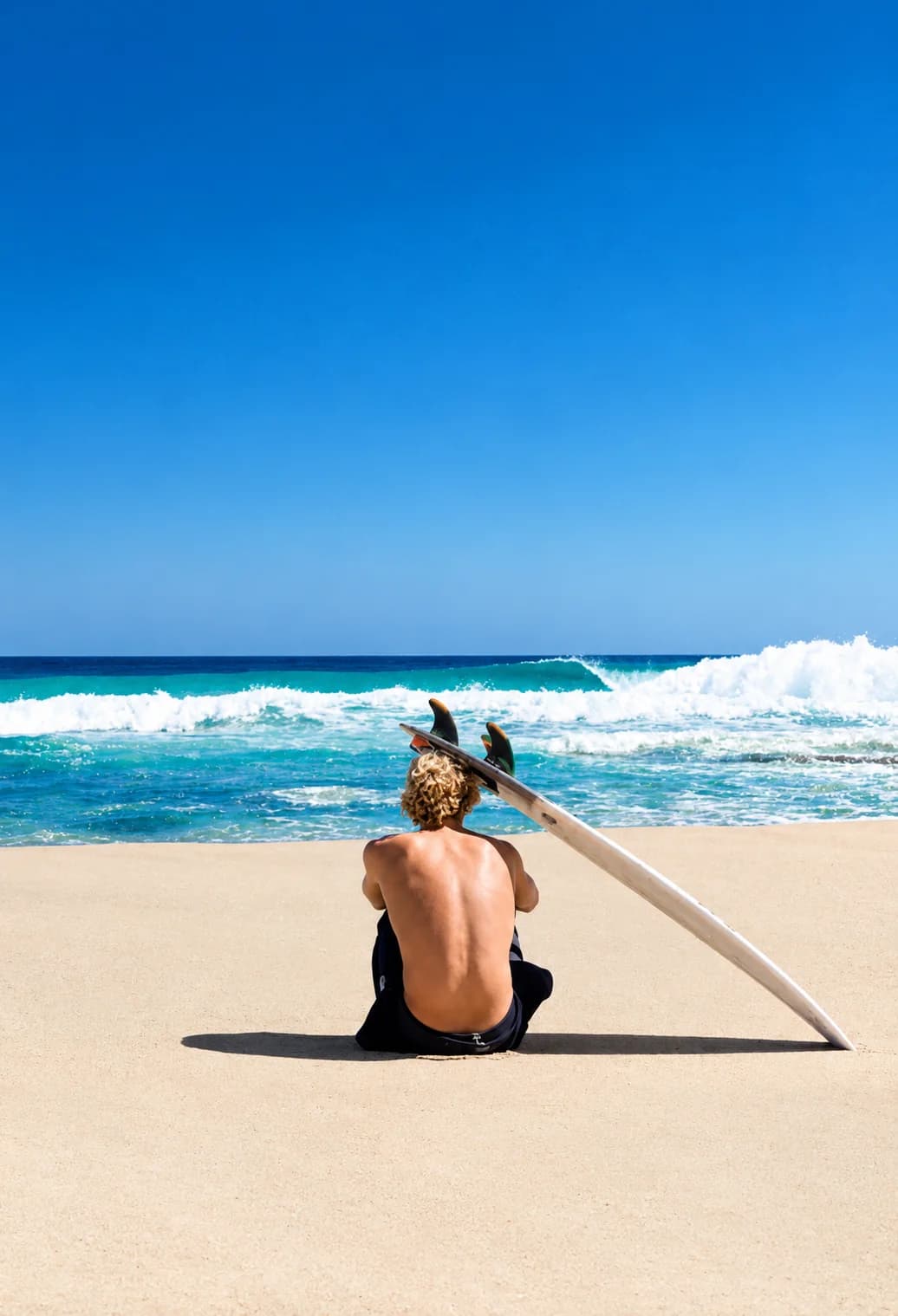 A coach guiding a surfer into a wave at Imi Ouaddar
