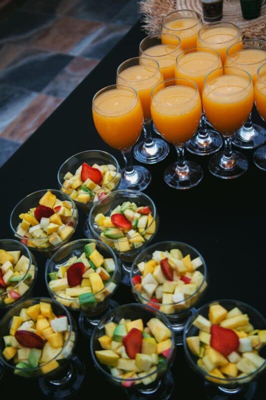 Fruit cups and fresh juice set out at the lodge