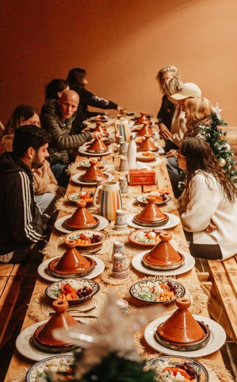 Guests sharing a Moroccan dinner at the lodge