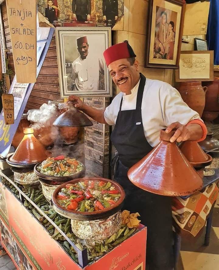 Tagines served on a wooden table at the lodge