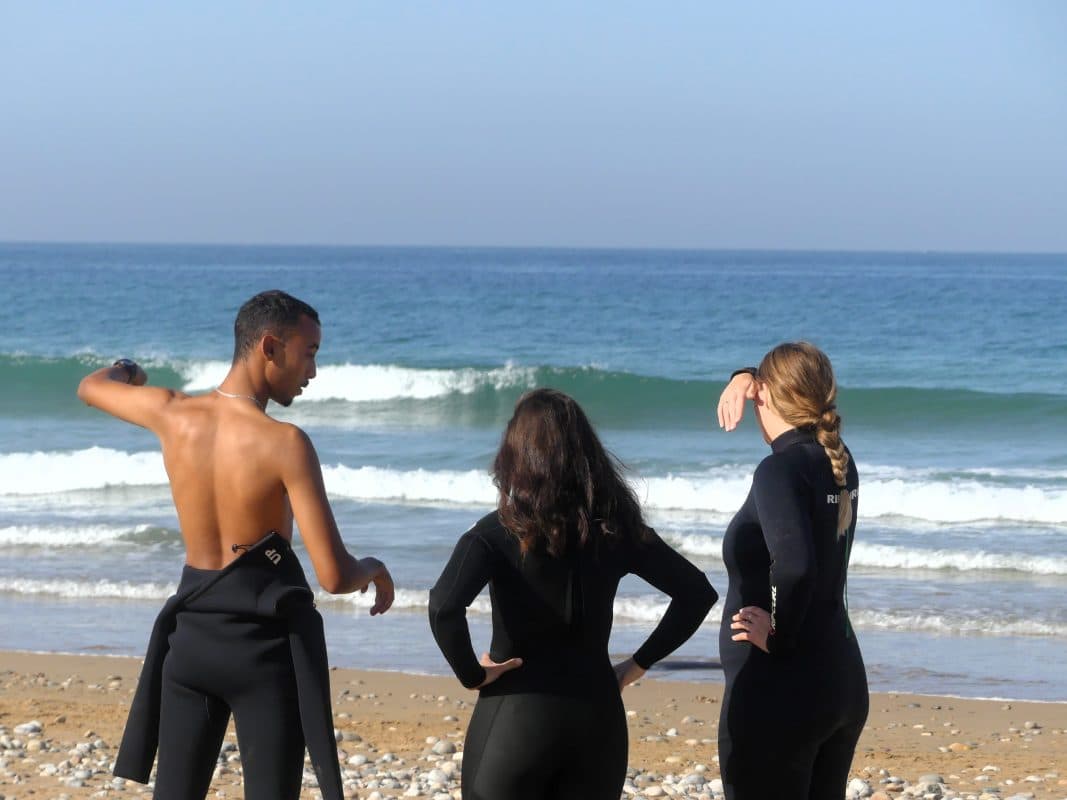 Surfers reading the sets from the beach
